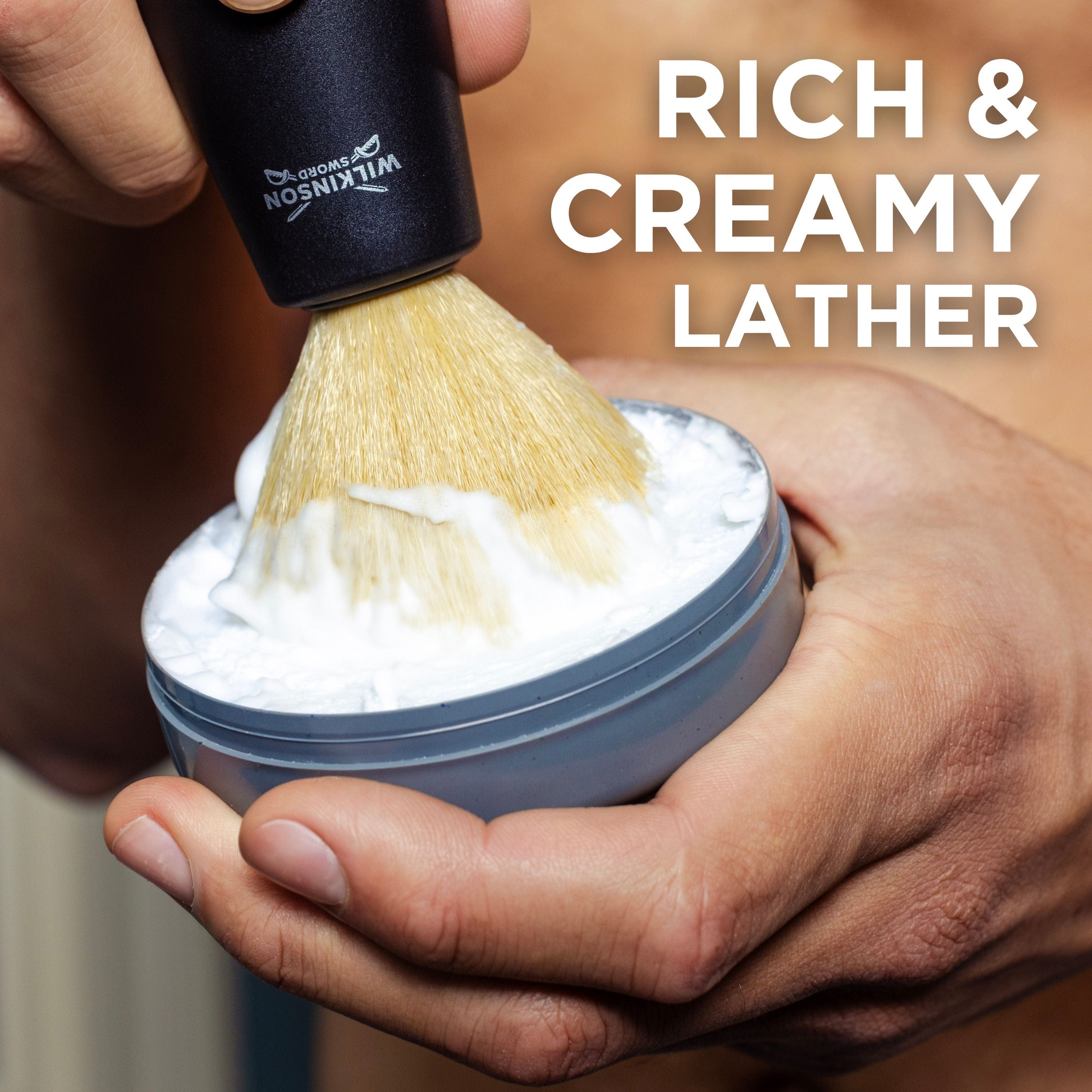 Man using Wilkinson Sword's Sensitive shave soap and shaving brush